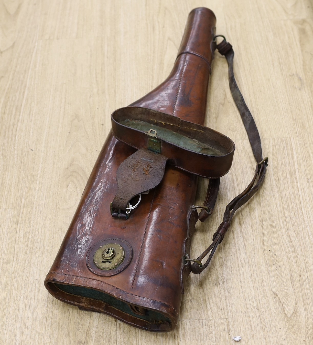 A James Purdey & Sons leather gun case and another brown leather gun case